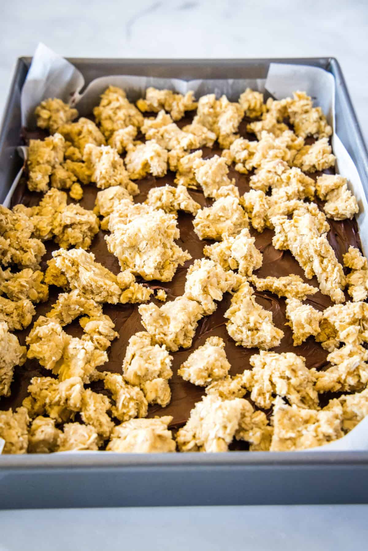 cookie dough dropped on top of chocolate layer